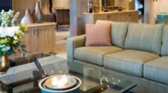 A living room with a couch and table