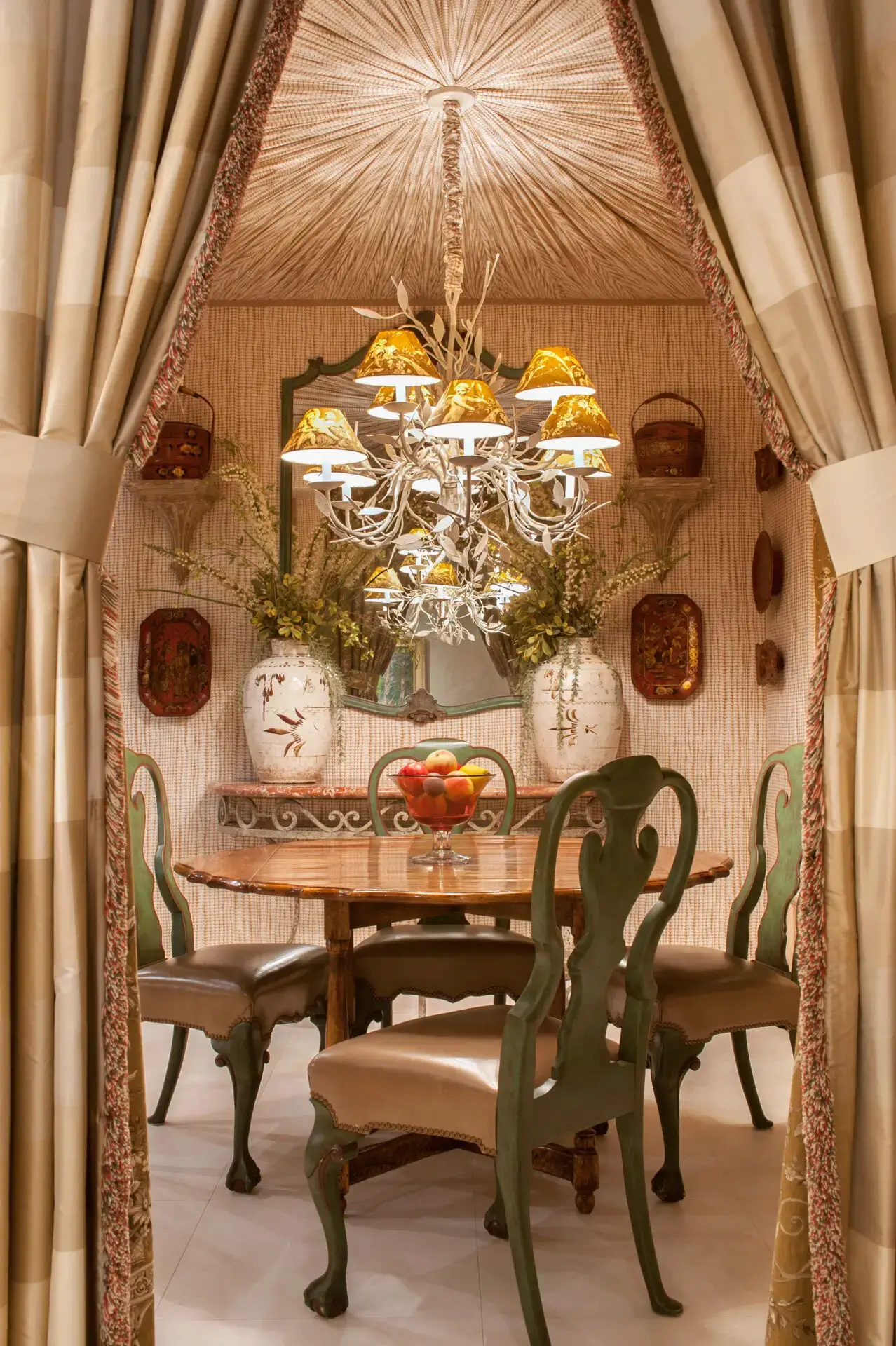 Cozy vintage dining nook with ornate chandelier and antique decor.